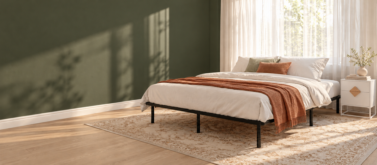Graham black metal bed frame with styled bedding and an Alaska white bedside table